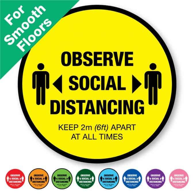 Round yellow Social Distancing Sticker for smooth floors that says "Observe Social Distancing" on the top plus 8 other colours o the bottom