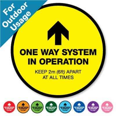 Round yellow Social Distancing Sticker for outdoor usage that says "One Way System in Operation" on the top plus 8 other colours o the bottom