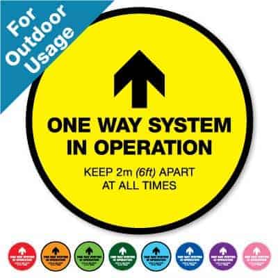 Round yellow Social Distancing Sticker for outdoor usage that says "One Way System in Operation" on the top plus 8 other colours o the bottom