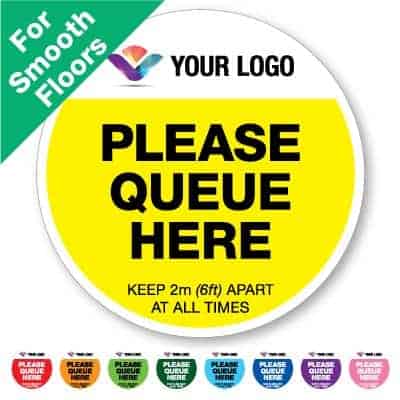 Round yellow Social Distancing Sticker for smooth floors branded with a logo that says "please queue here" on the top plus 8 other colours o the bottom